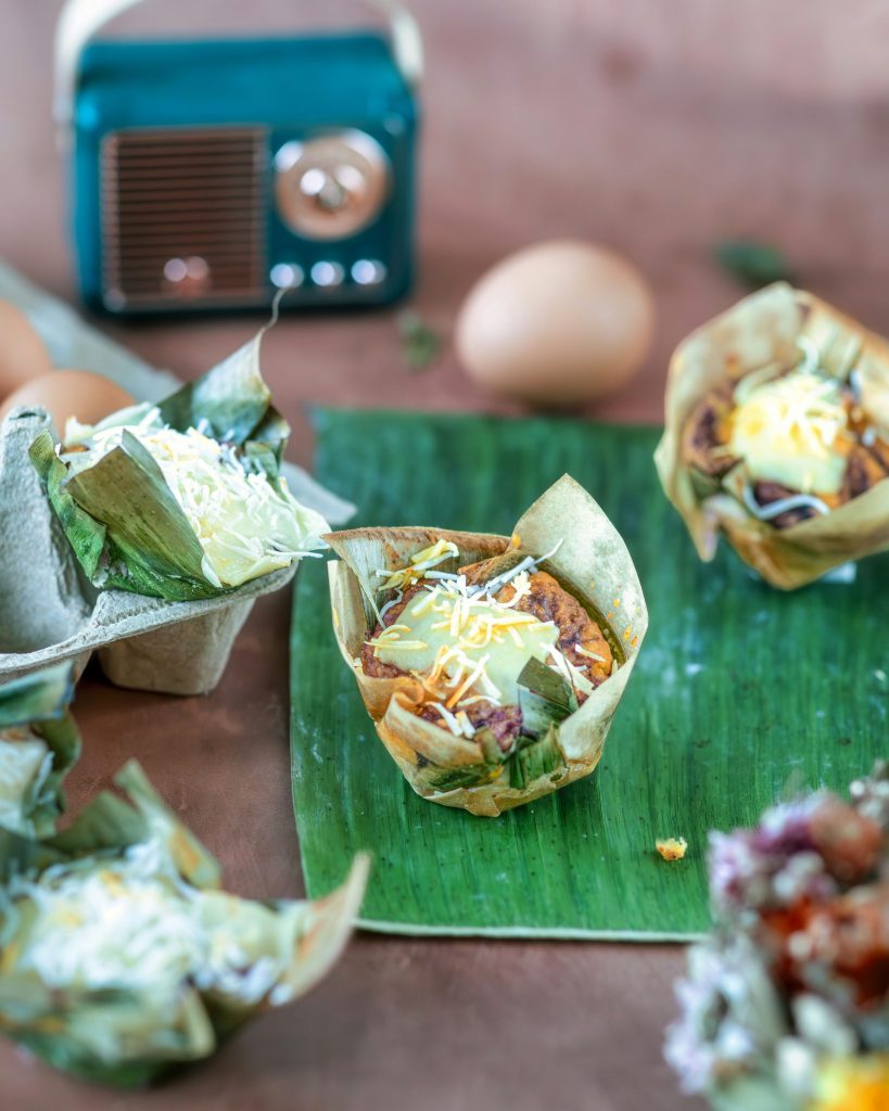a plate of food on a banana leaf